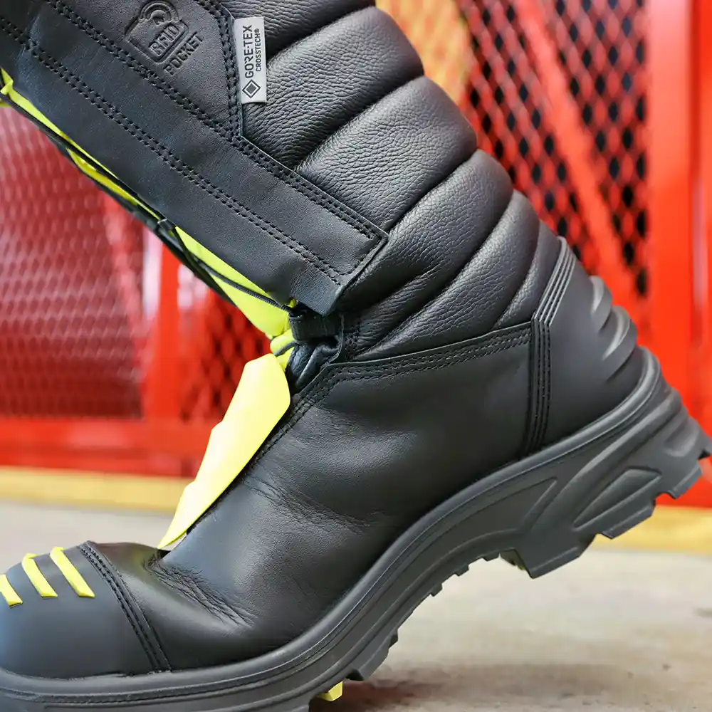 Close-up of black and yellow Fire Eagle Xtreme bunker boots mid step, highlighting lightweight comfort with an athletic fit.