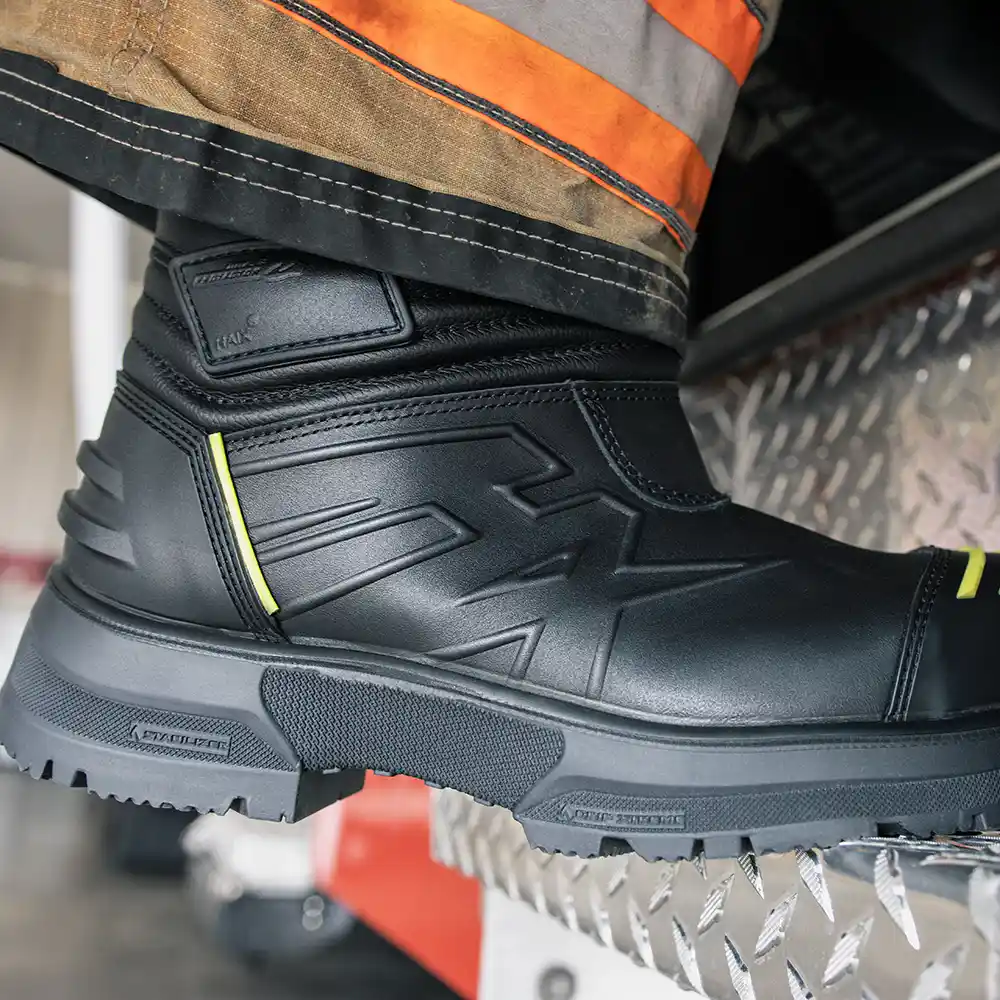 Close-up of Fire Eagle Air GX firefighter boots stepping on diamond plate step, featuring cushioned insole comfort.