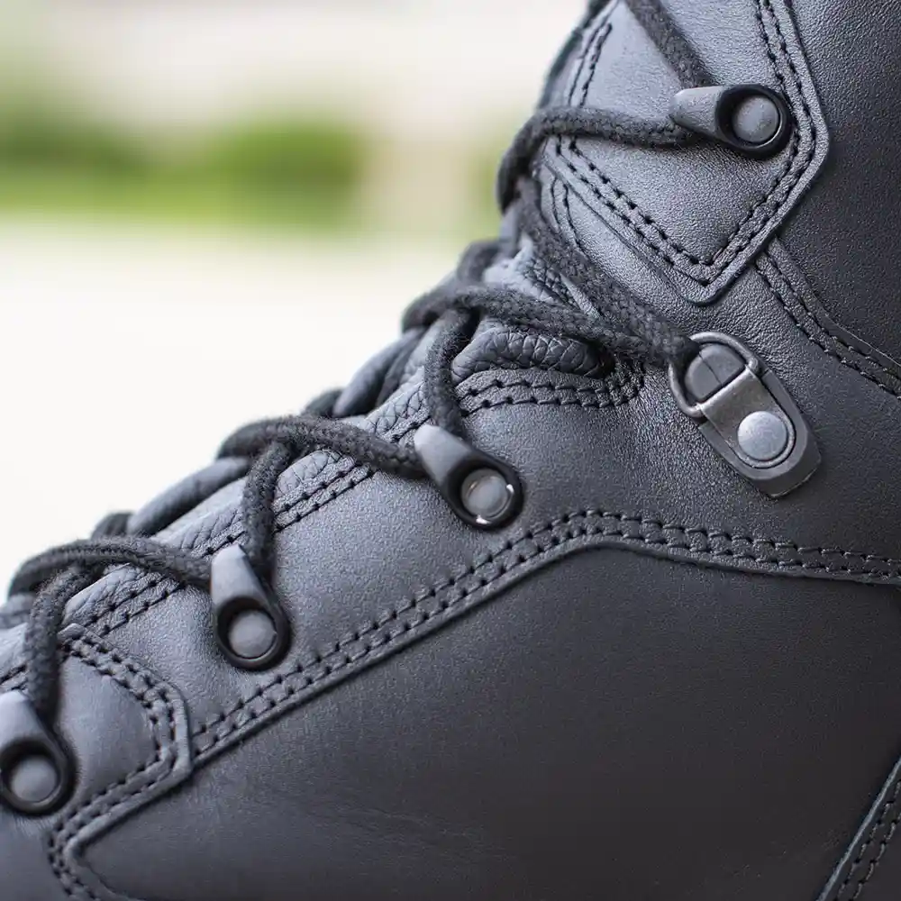 Close-up on 2-Zone lacing of black Enforce X High Winter work boots for a custom fit.