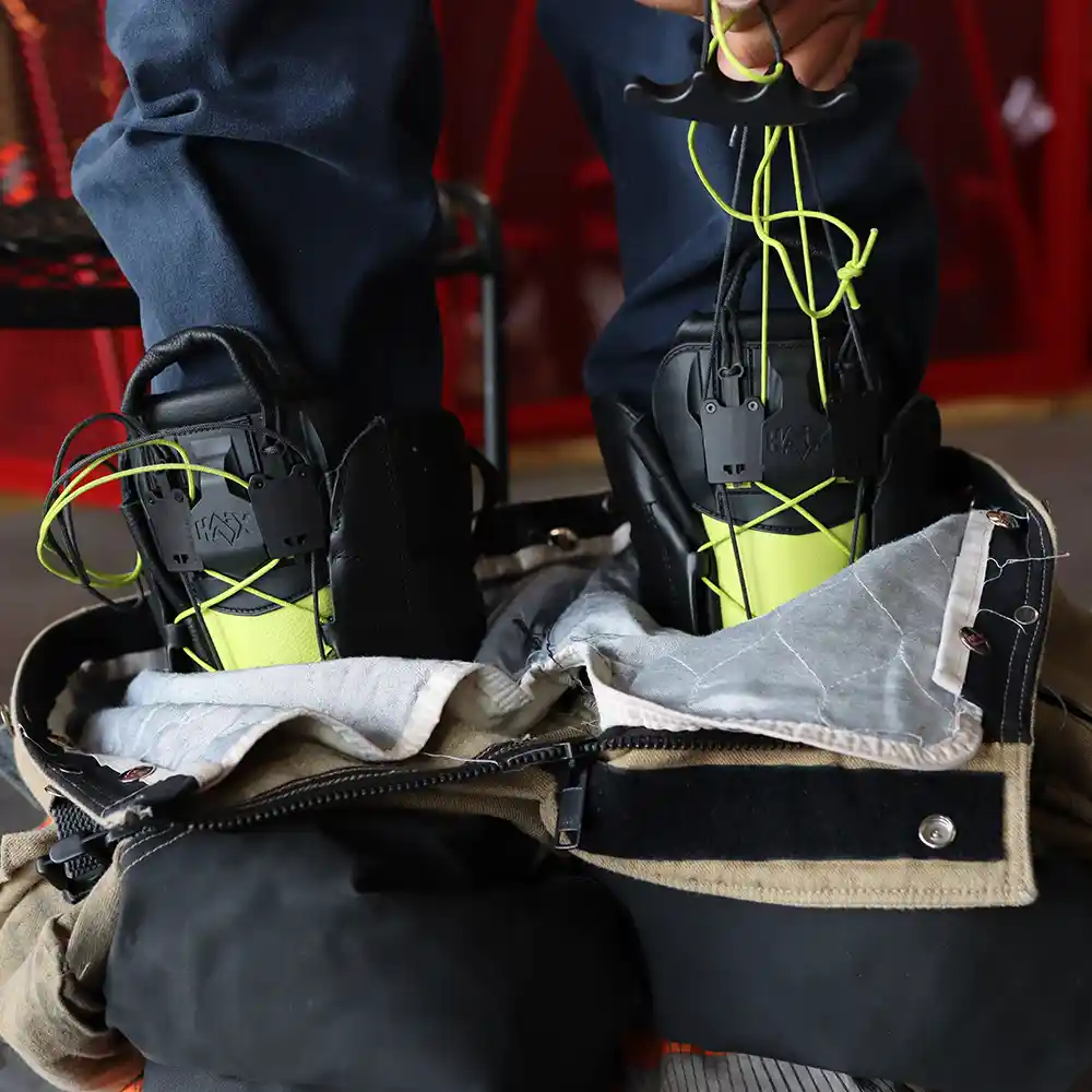 Fire Eagle Xtreme RAPIDfit lacing  in use with bunker pants laying around boot, highlighting a custom fit with 2-zone lacing.