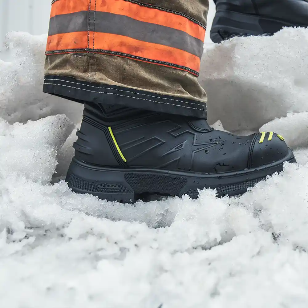 Black Fire Eagle Air Grip Xtreme waterproof boots on snow, featuring  the HAIX Climate System for breathable comfort.